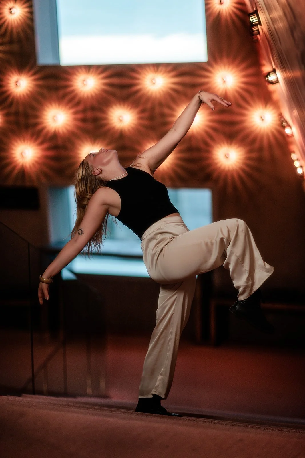 A photograph of a woman within the forum Groningen, Netherlands taken mid dance by portrait photographer Darius N Fernandes