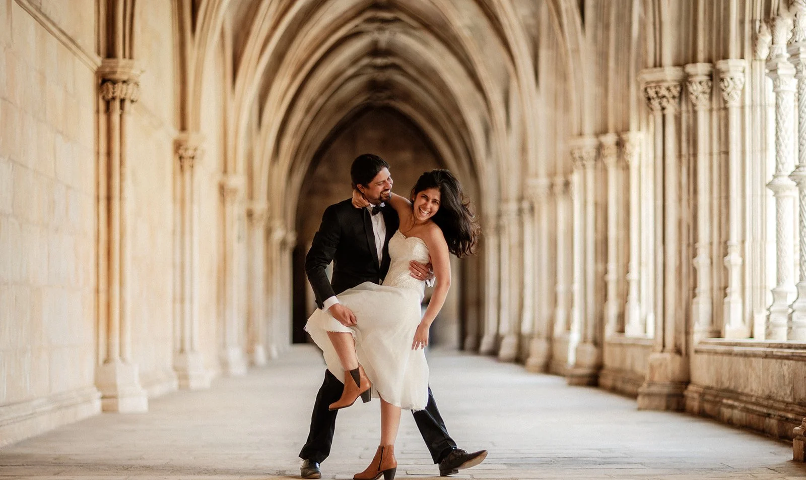 A photograph of a bride and groom having a lovely time at a church in Portugal taken by Darius N Fernades 