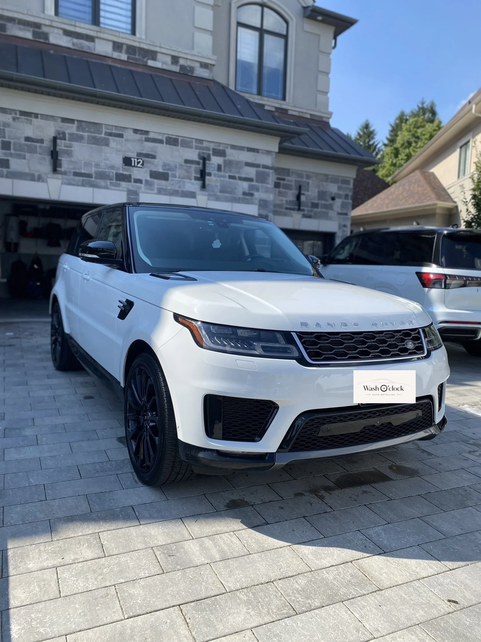 A white Range Rover parked on a driveway. exterior car detailing white SUV clean finish Vaughan