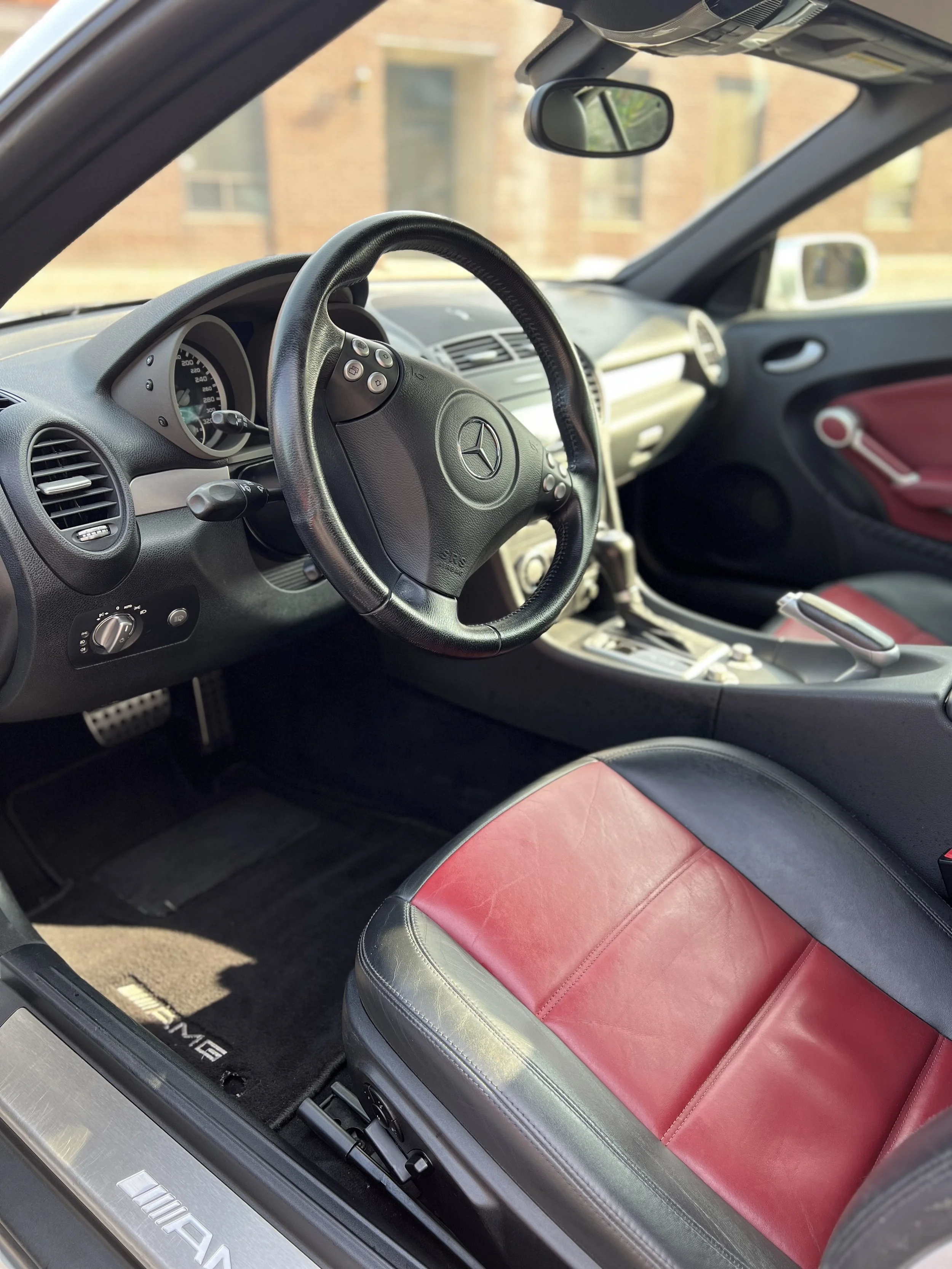 Interior of a Mercedes-Benz vehicle, interior car detailing black red seats deep cleaning Toronto