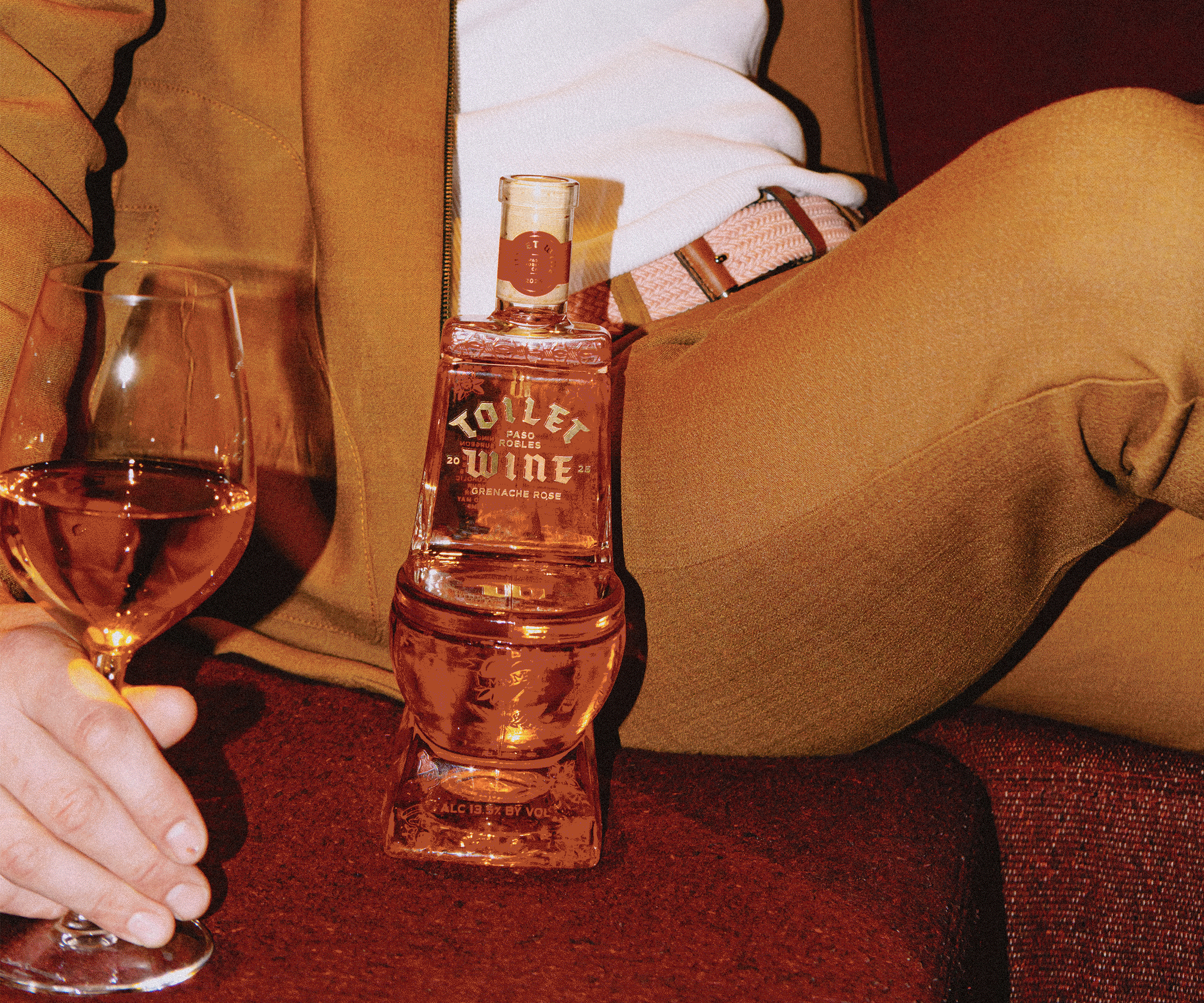 Friends enjoying Toilet Wine together, sharing wine and good times in a lively social setting.