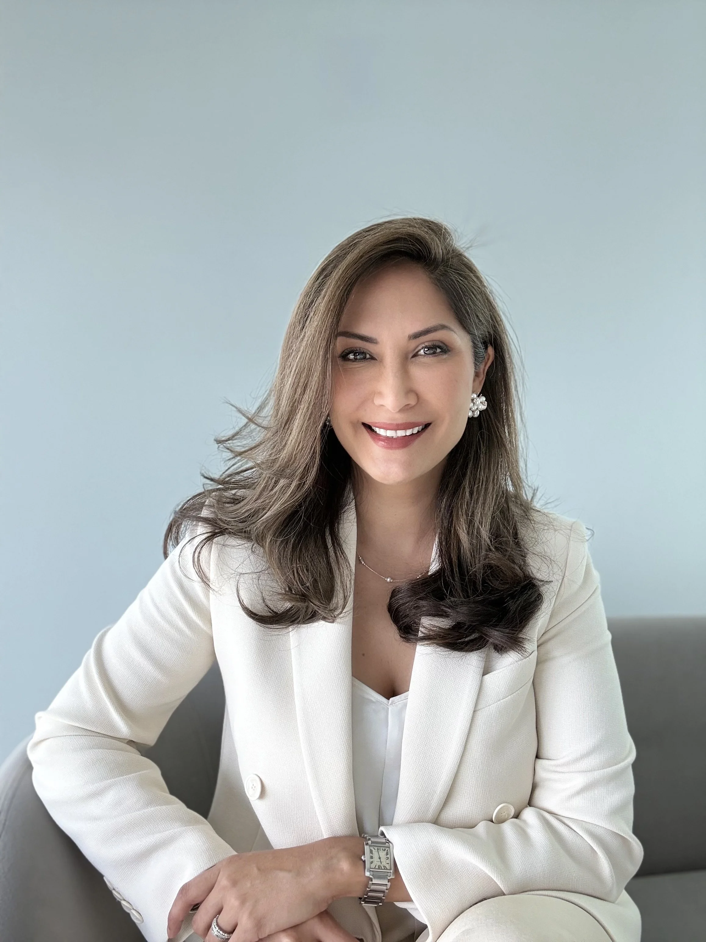 Melissa Miranda seated and smiling at camera