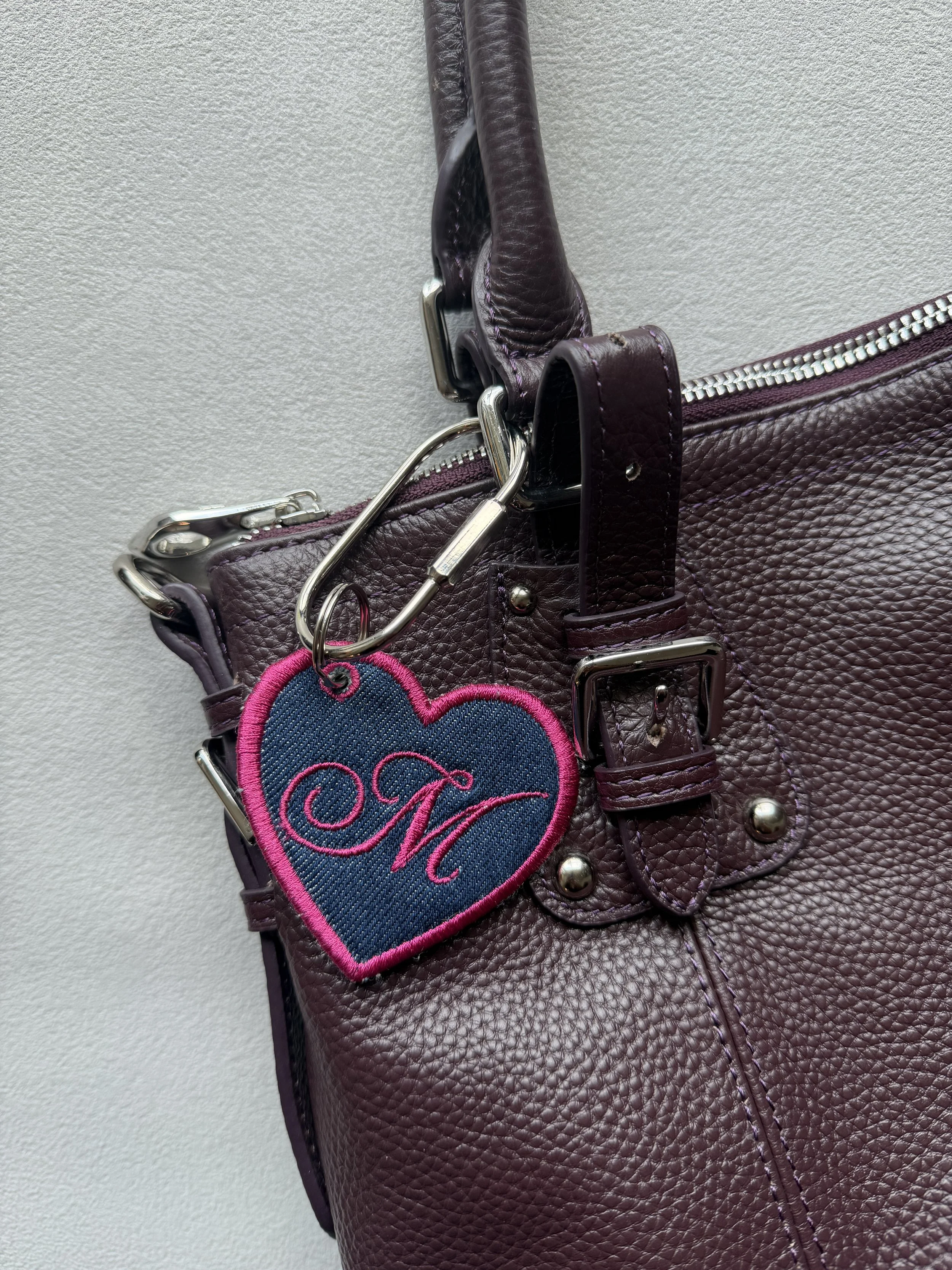 Embroidered heart charm with silver hardware