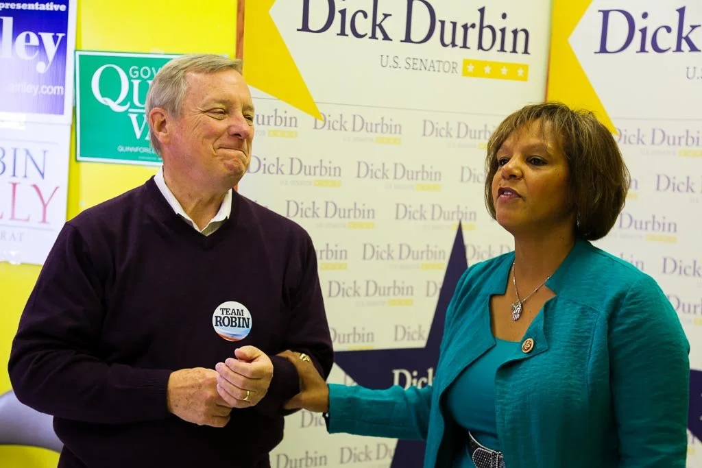A man with a woman at a political campaign.