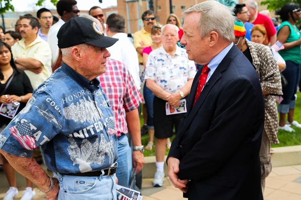 Two men are engaged in a conversation