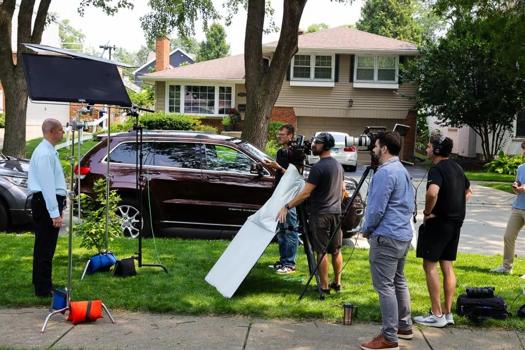 A film crew is filming a man.