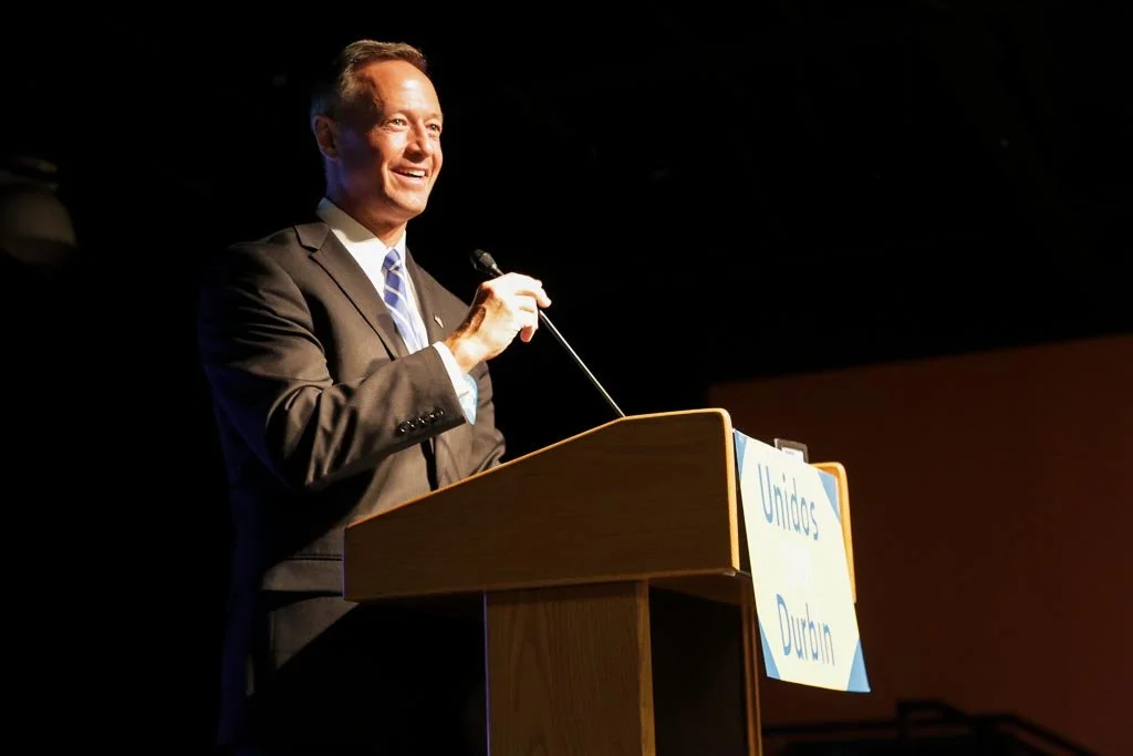 A man speaking into a microphone.