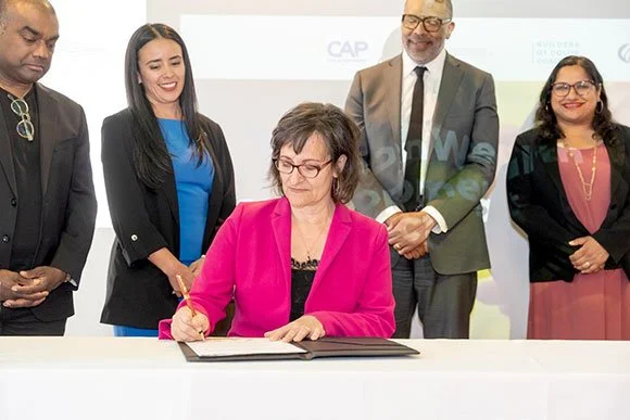 Somerville Mayor Katjana Ballantyne signs Commonwealth Development Compact.