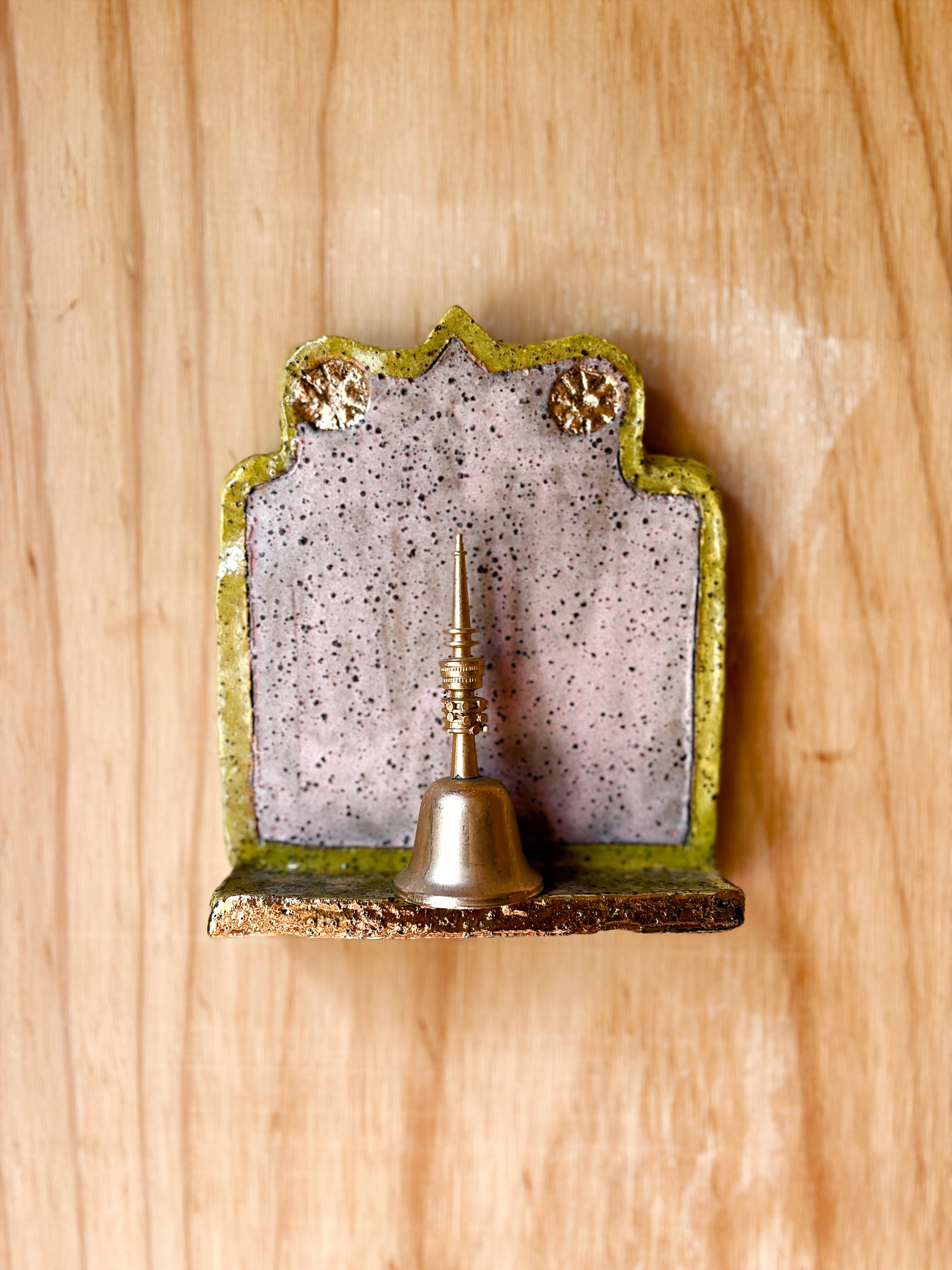 Life Alters - 'Ring for Champagne' 

Hand-built slab ceramic wall artwork, BRT mid-fire clay, underglaze, clear gloss glaze and gold lustre detail. 16cm h x 13cm w x 4cm d. 

Inspired by the ‘buchette del vino’ (wine walls) of Florence—tiny windows i