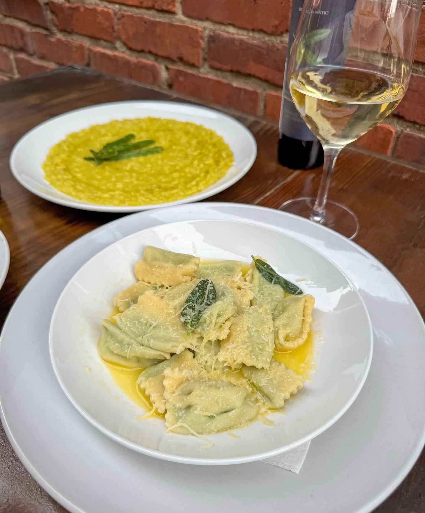 House made Ravioli: spinach, lemon zest, nutmeg and ricotta filling, butter, sage and parmigiano reggiano sauce