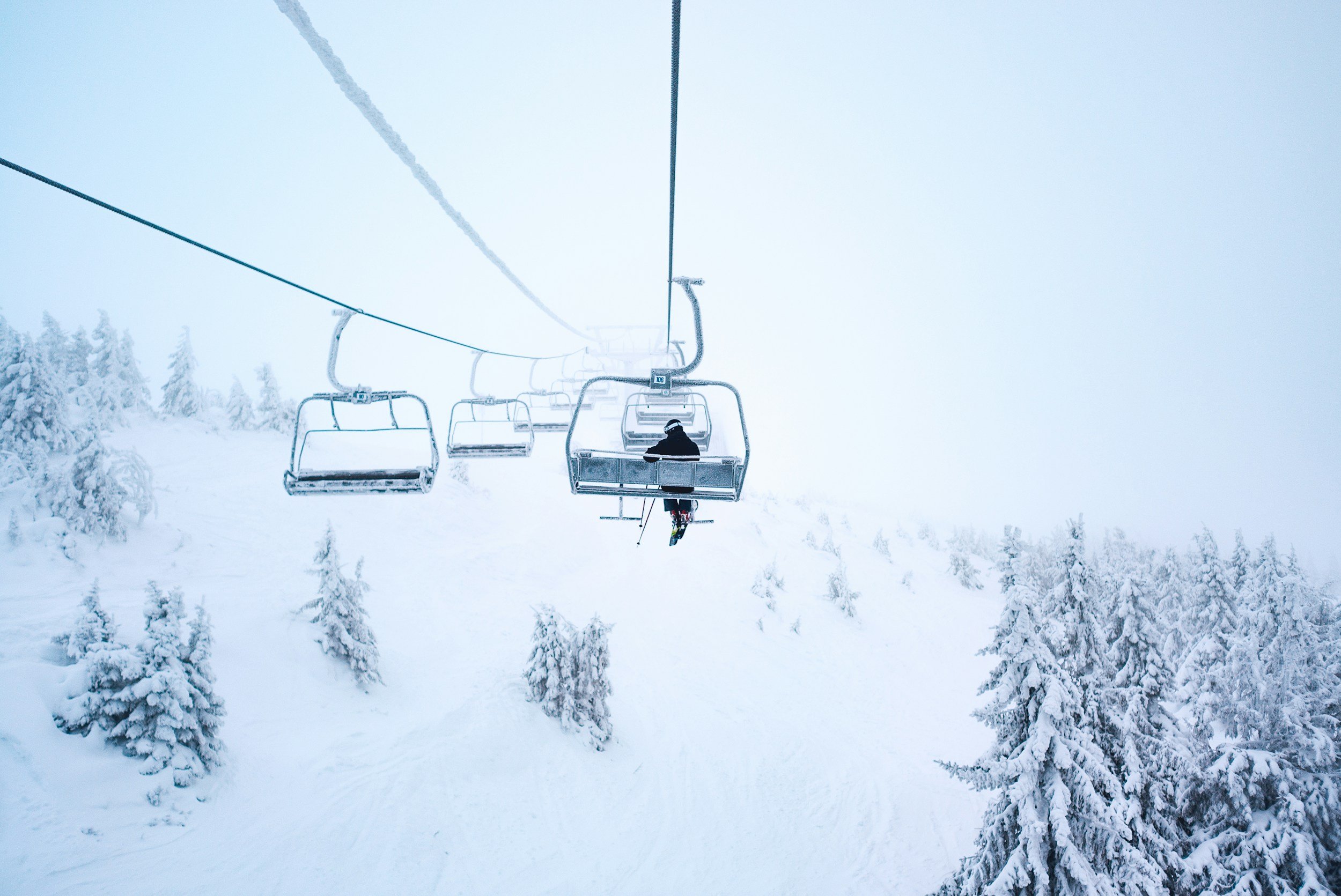 Chairlift over a snowy ski slope