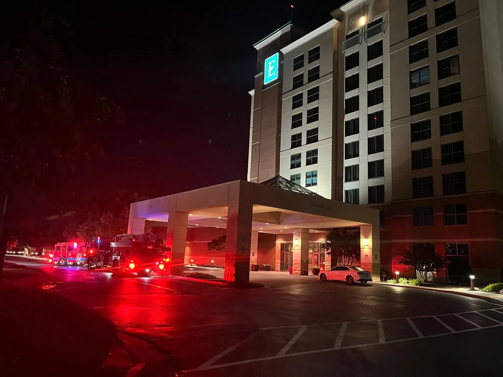 MFRD units at the Embassy Suites Murfreesboro entrance before dawn; the hotel tower was never evacuated