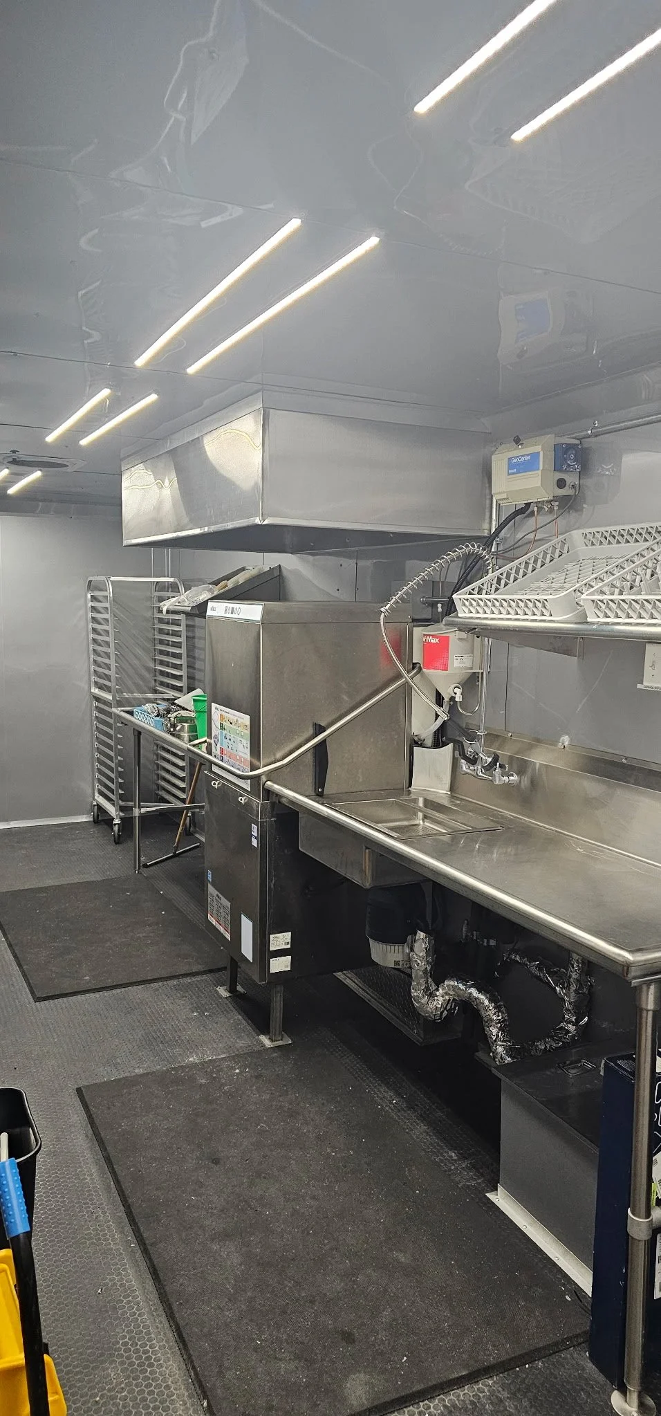 Commercial cooking line inside an On-Site Kitchen Solutions mobile kitchen trailer