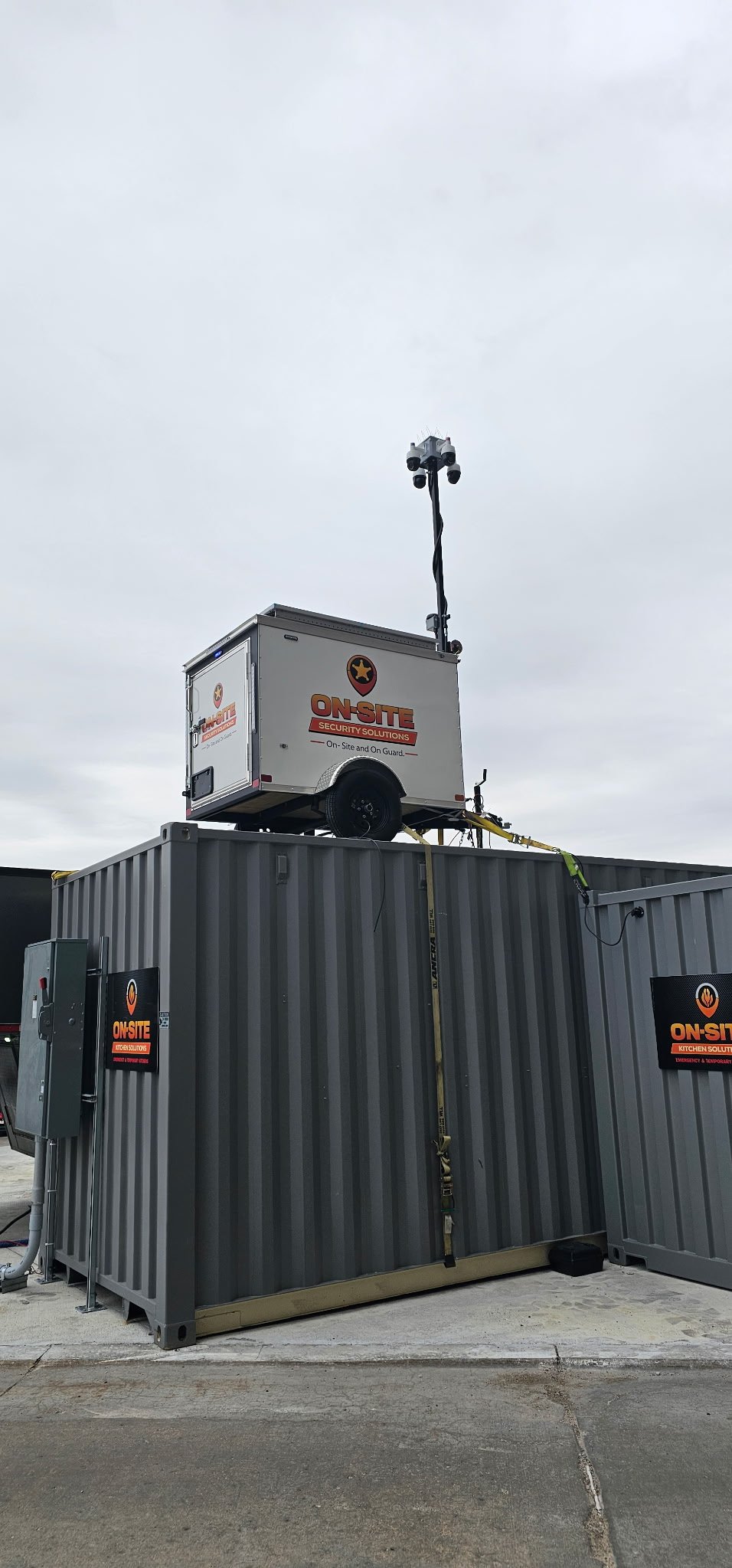 On-Site Security Solutions camera tower mounted on a storage container for elevated jobsite surveillance
