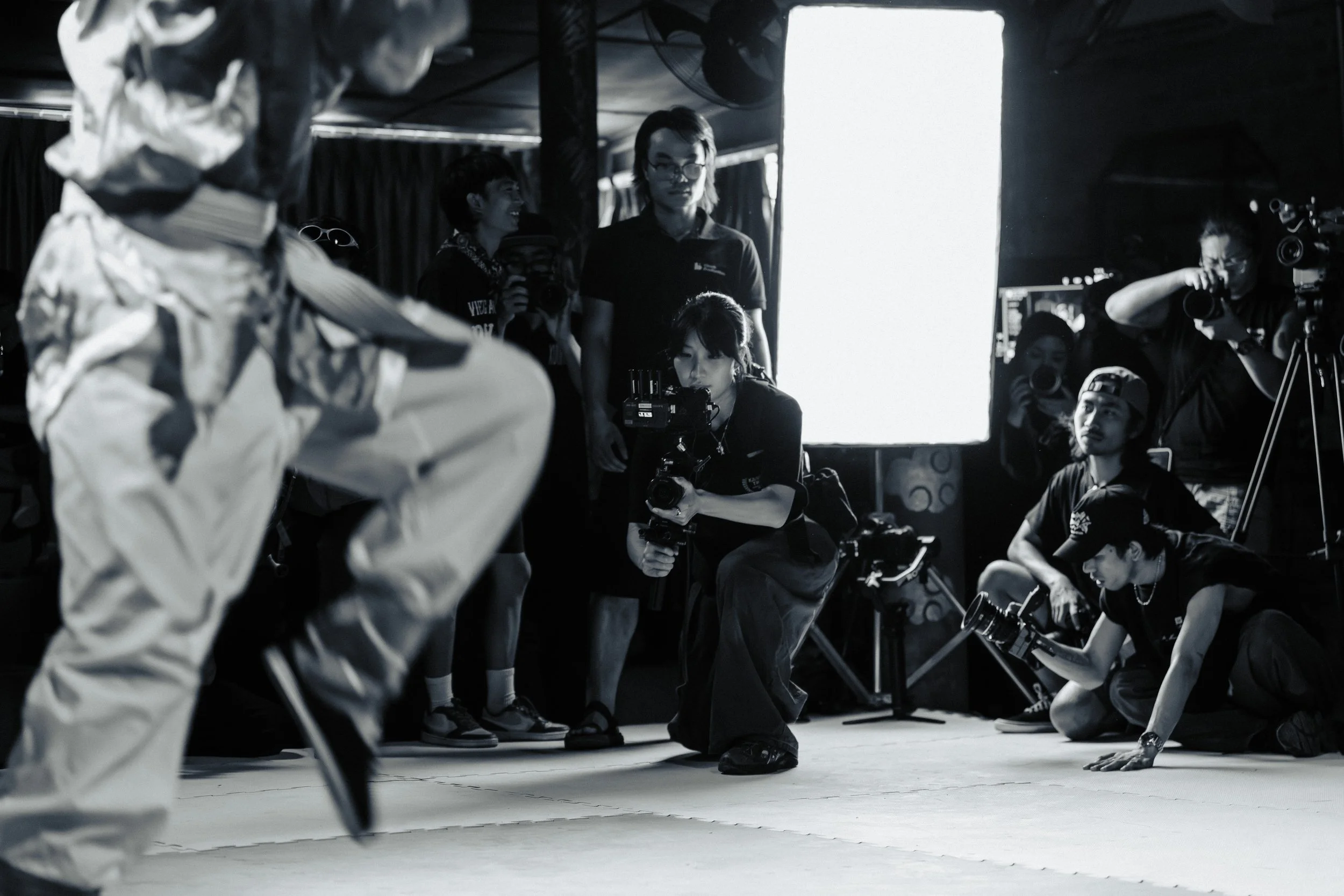 Amanda Khoo directing a cinematic production with her film crew in Singapore
