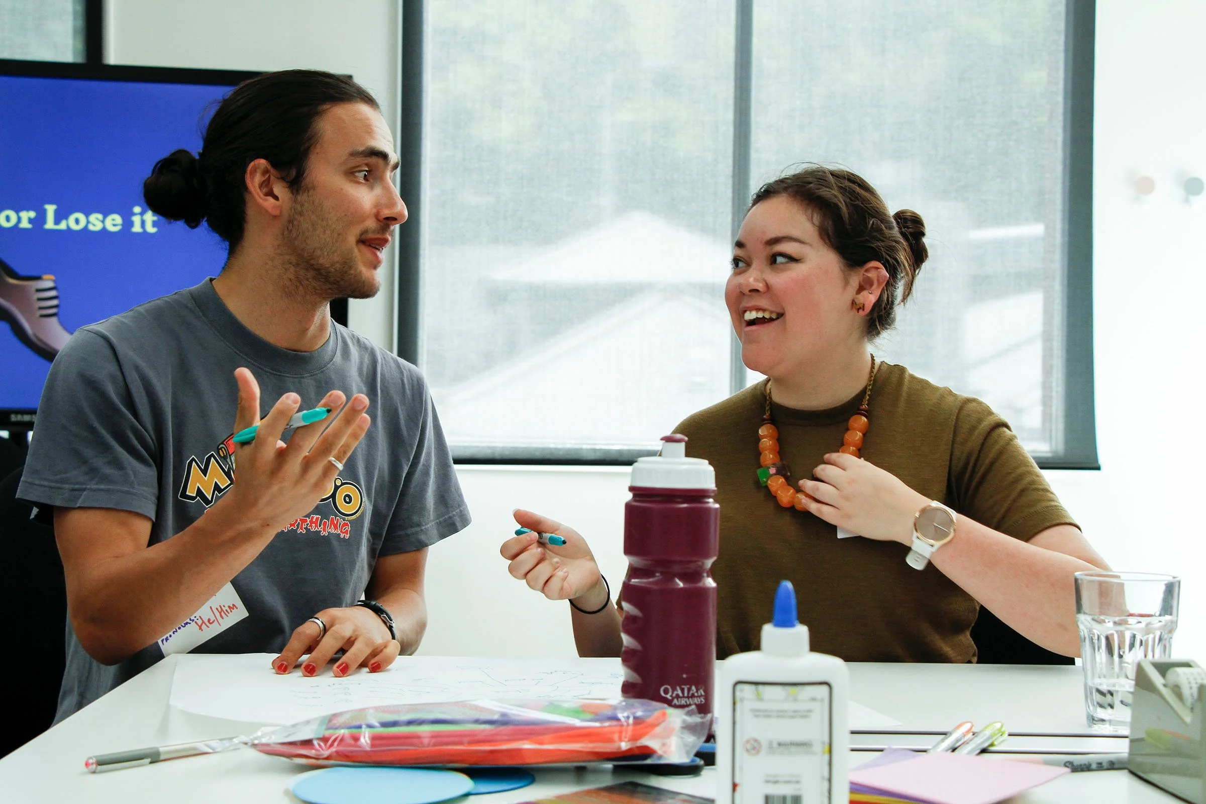 Two young people working together to address gender inequality