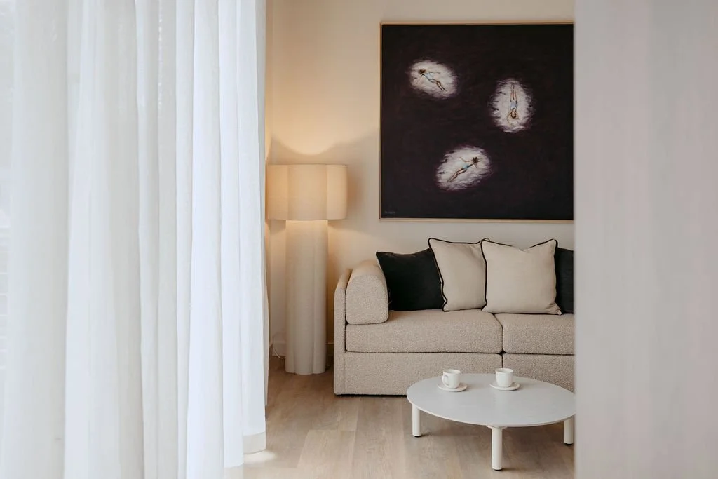 Luxury living space at Sola Studios Margaret River featuring boutique interiors, textured furnishings, curated artwork and soft natural light designed for slower stays.