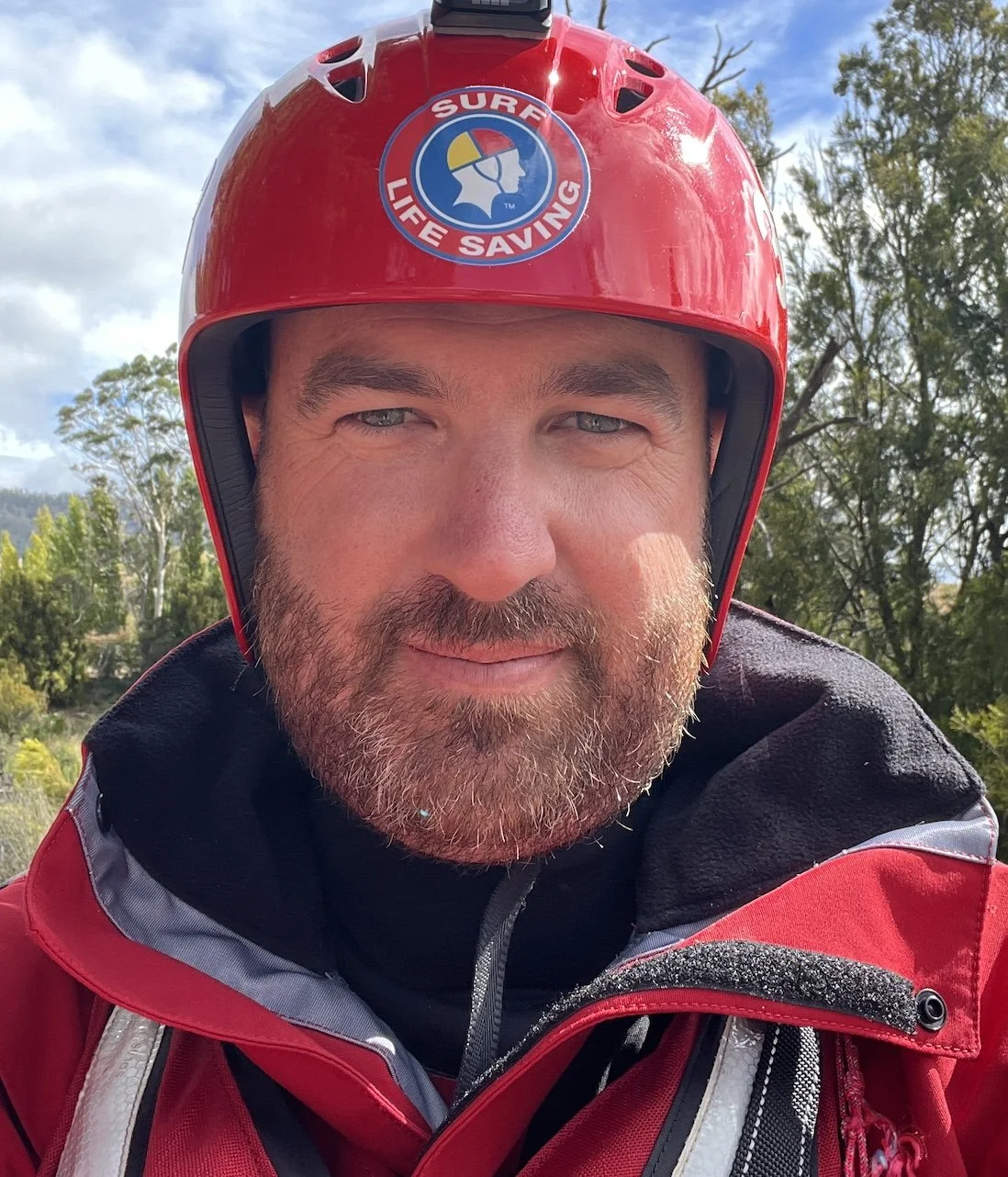 A man wearing a red helmet