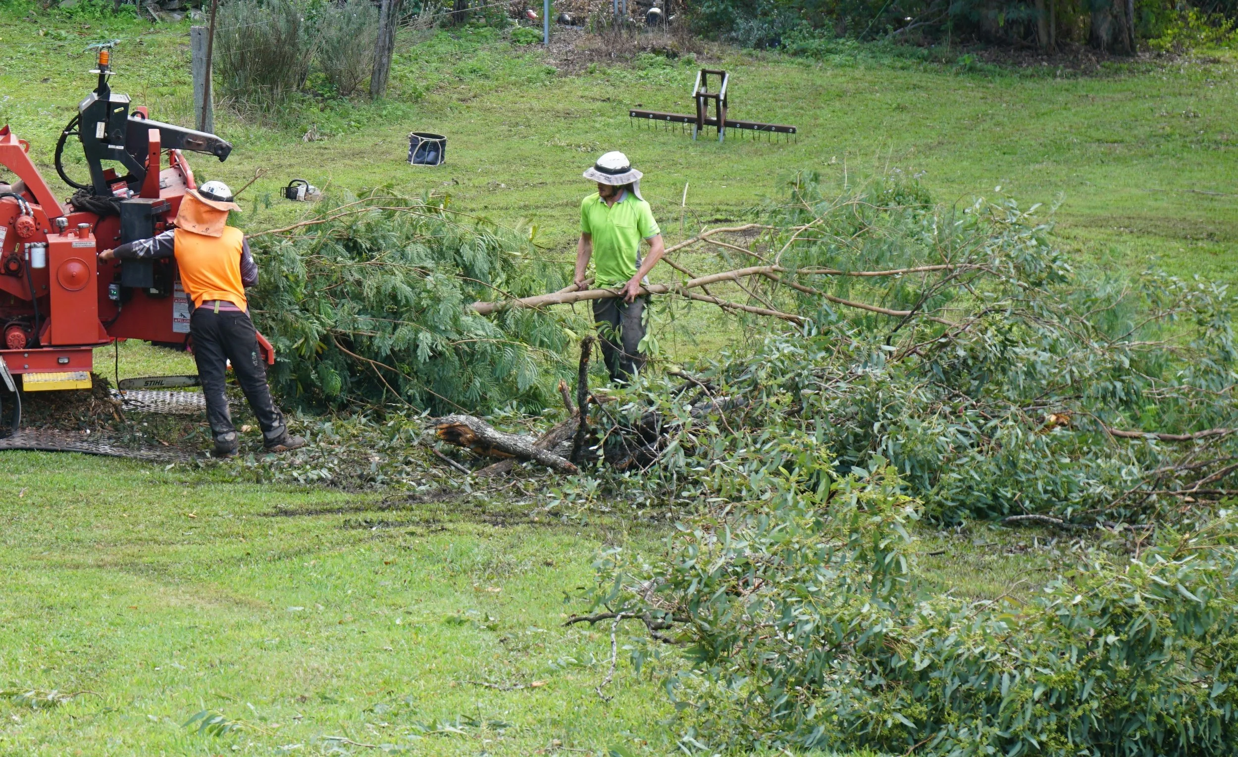 Feeding branches through our chipper