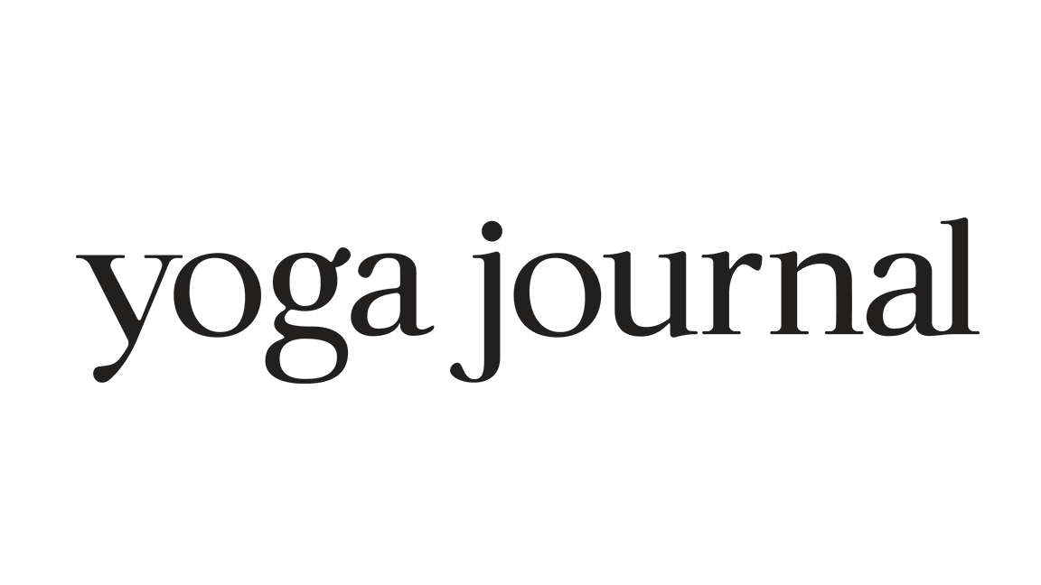 Black and white logo with the words "yoga journal" in lowercase, modern font.
