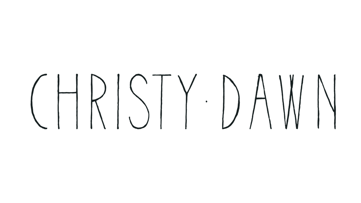 Text logo reading 'Christy Dawn' written in a thin, elongated font on a black background.