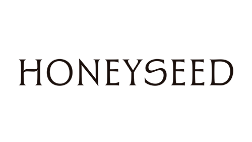 The word 'HONEYSEED' written in dark brown letters on a black background.