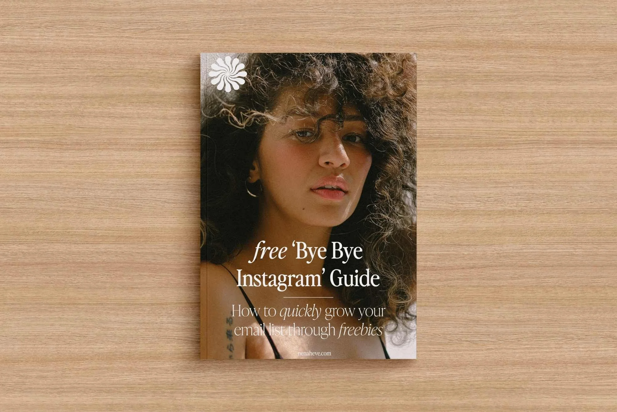 A magazine or booklet cover featuring a close-up portrait of a woman with curly brown hair, wearing hoop earrings, and looking at the camera. The text on the cover says 'free 'Bye Bye Instagram' Guide,' and the background is a wooden surface.