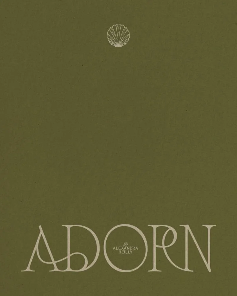 Green book cover titled "Aborn" by Alexandra Reilly, featuring a small shell illustration at the top.