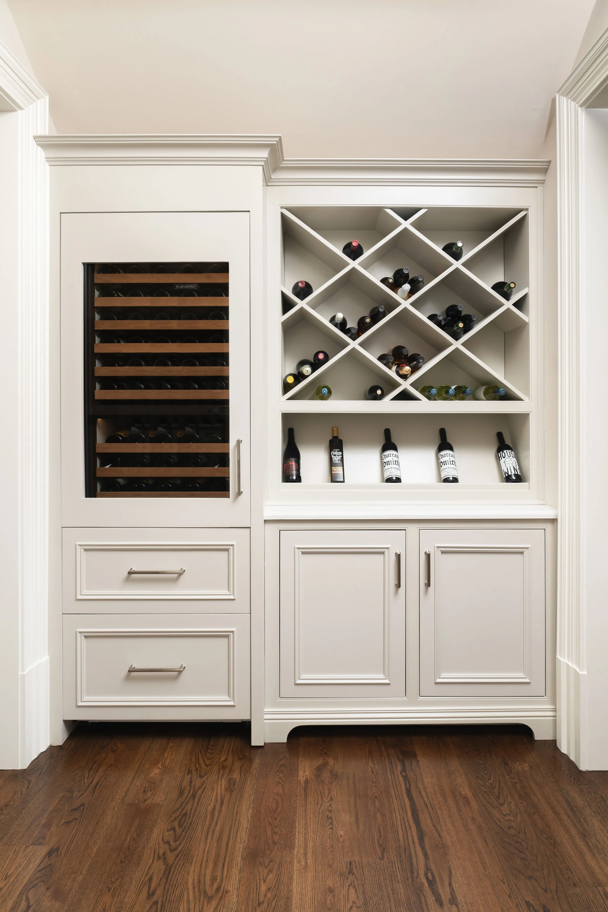 Custom wine rack and wine fridge built-in, designed by Interior Styles, interior design in North Georgia.
