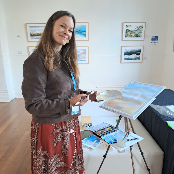 Jemma Newman painting live at the International Watercolour Exhibition in 2026