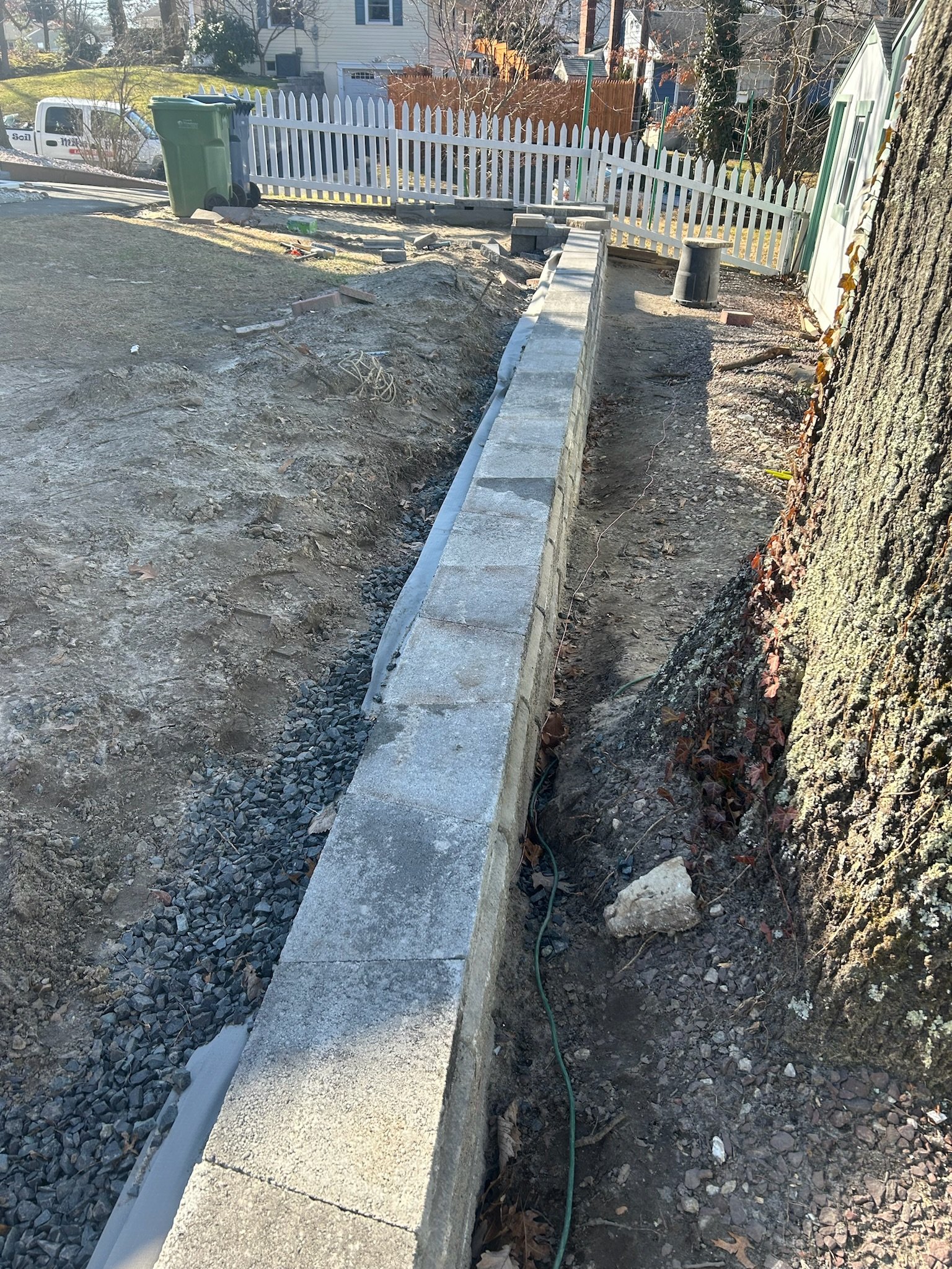 Mike Price Lawn Service installs retaining wall.