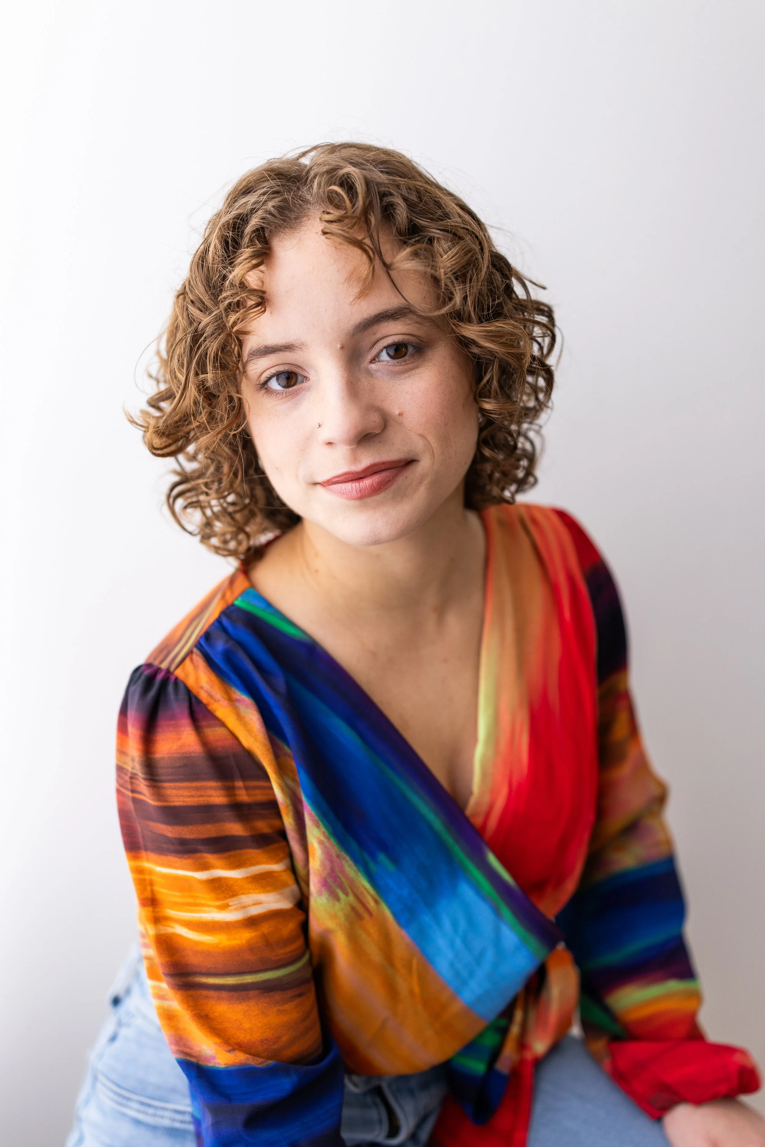 Eva Luna Cirilo commercial headshot in colorful top.