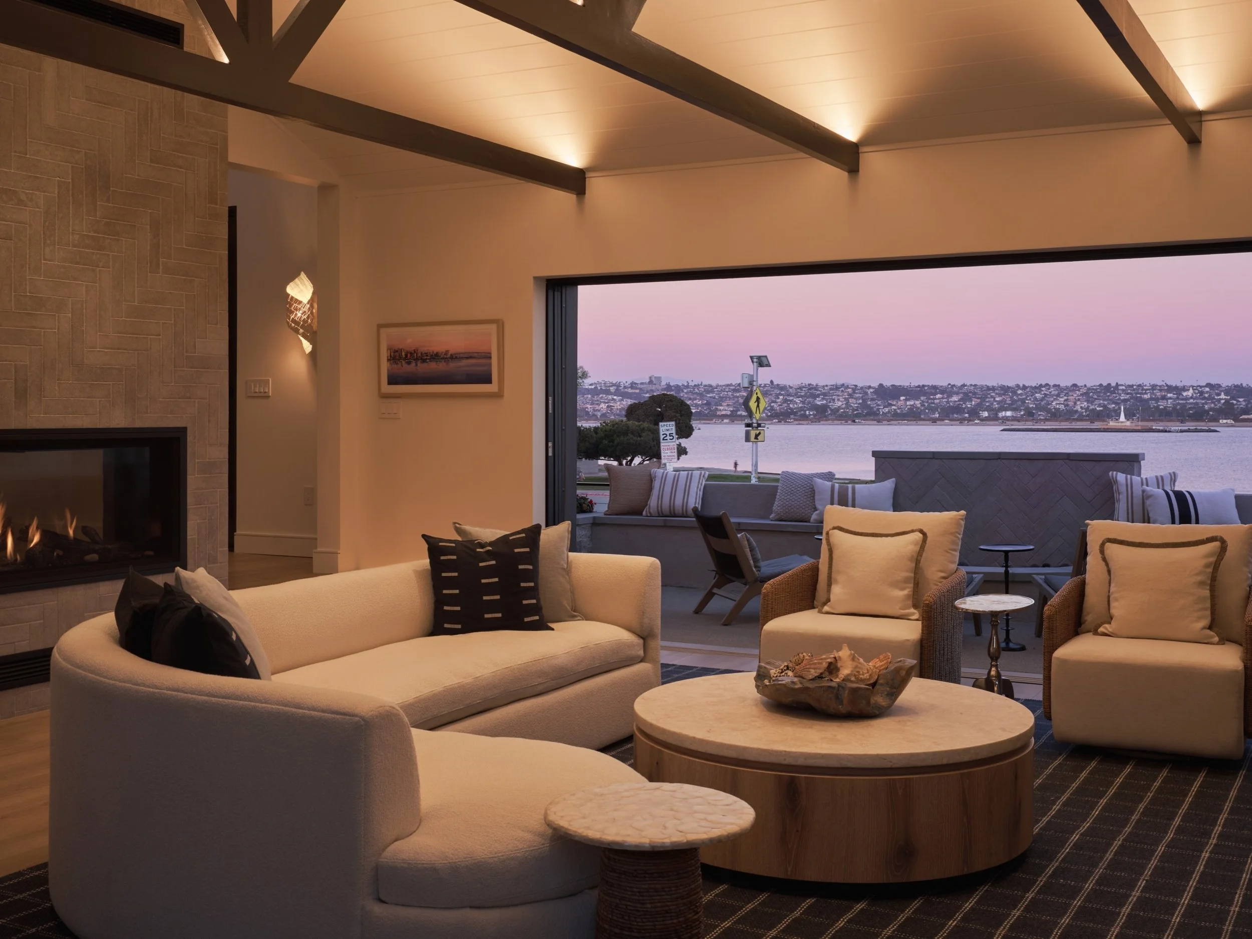 A little before &amp; after for ya this mornin&rsquo; ✨

We reimagined this once dark and dingy living room to reconnect it with its most important feature&hellip; that beautiful bayfront setting.

Instead of peppering the ceiling with recessed downl