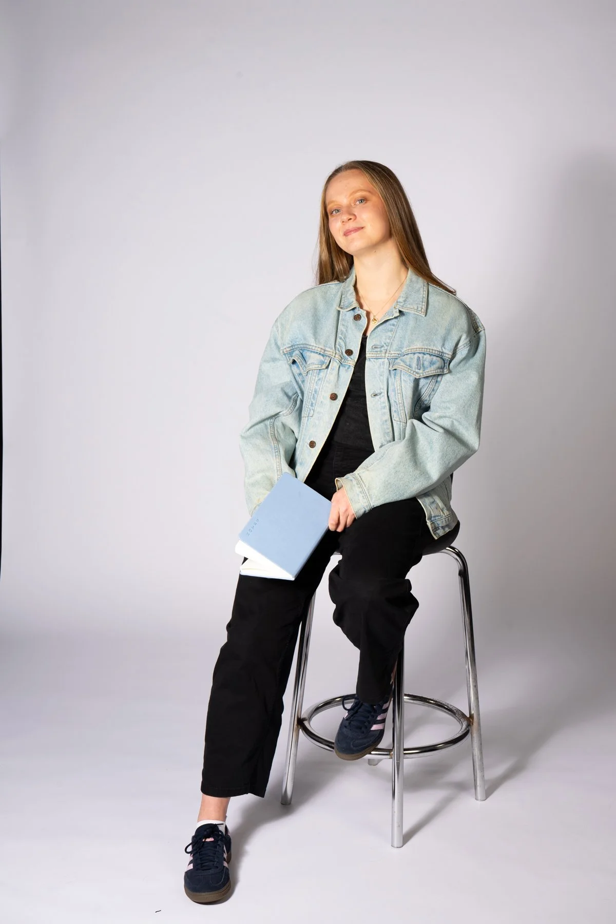 Editorial portrait of Humber extramurals volleyball player Julie Harris in a bright studio setting.