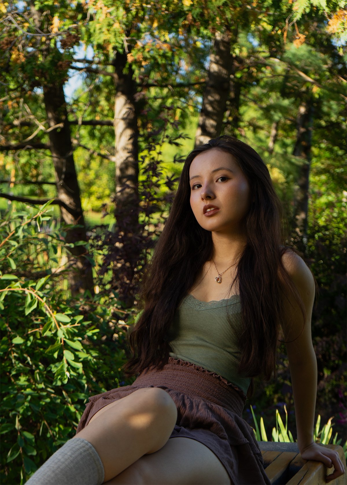 Media student Zhanzaya posing for an environmental portrait in the Humber Arboretum during late summer in Etobicoke.