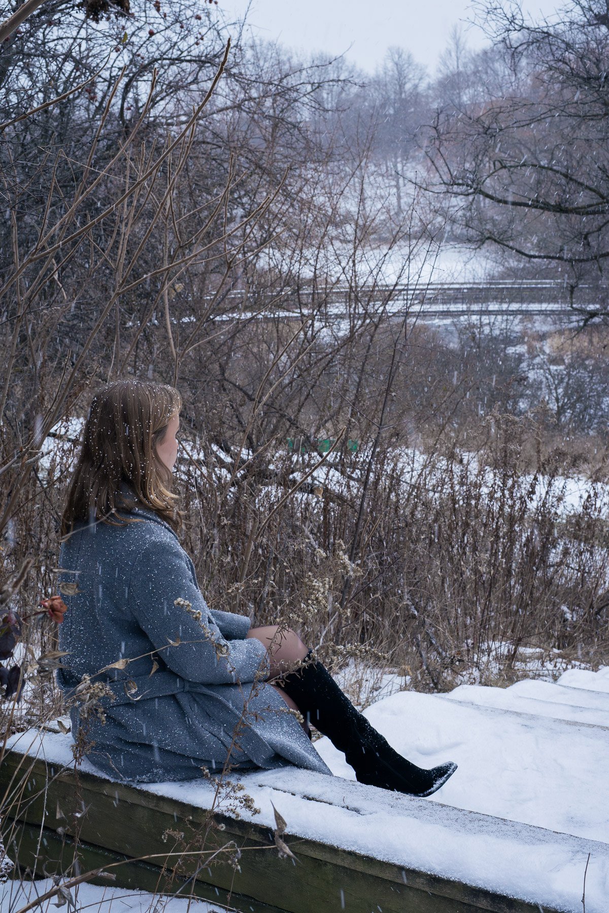 University of Guelph-Humber student Abigail Flipsen posing for a winter portrait in the Humber Arboretum.
