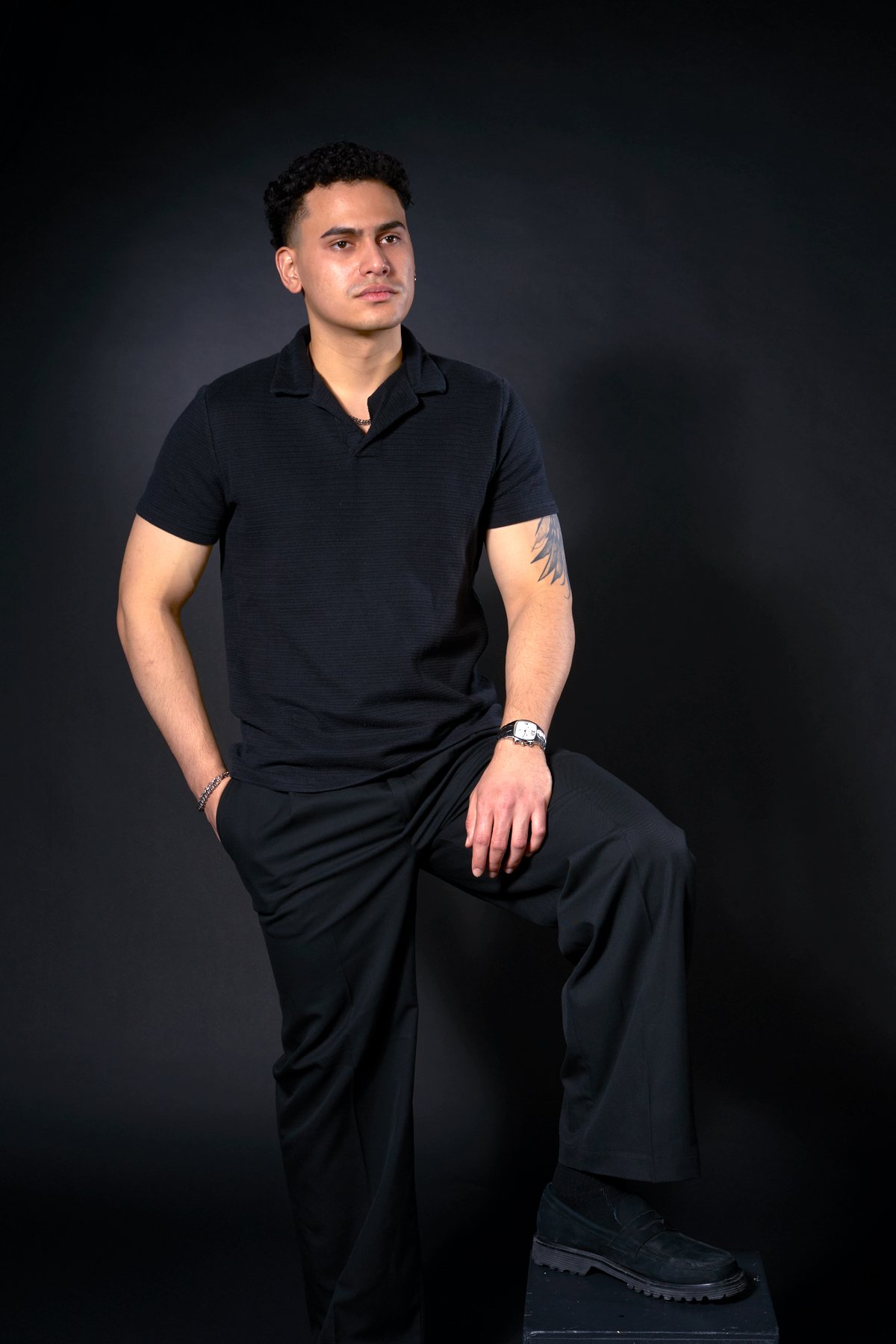 Male model Carlos in a high-key fashion pose at the L148 private photography studio in Toronto.