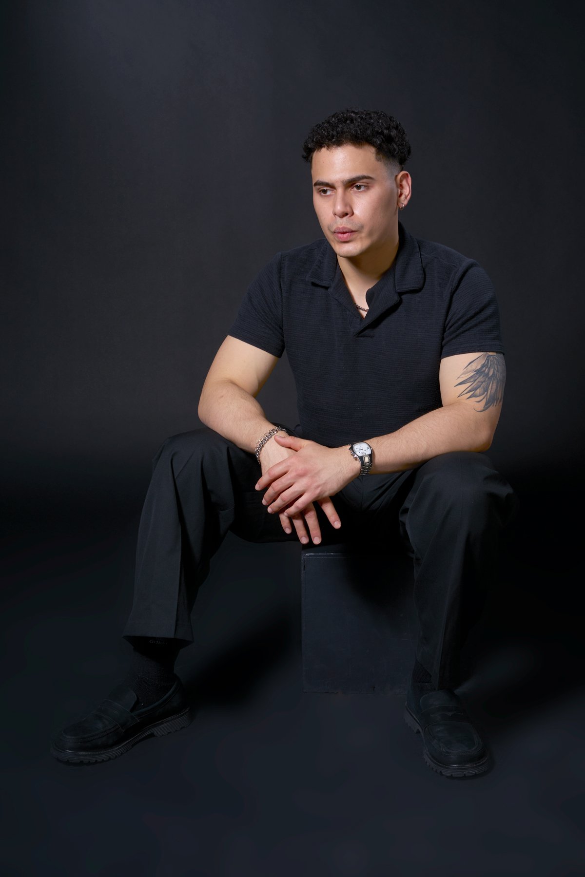 Carlos posing for a high-key lifestyle photoshoot in the L148 private studio at Humber College.