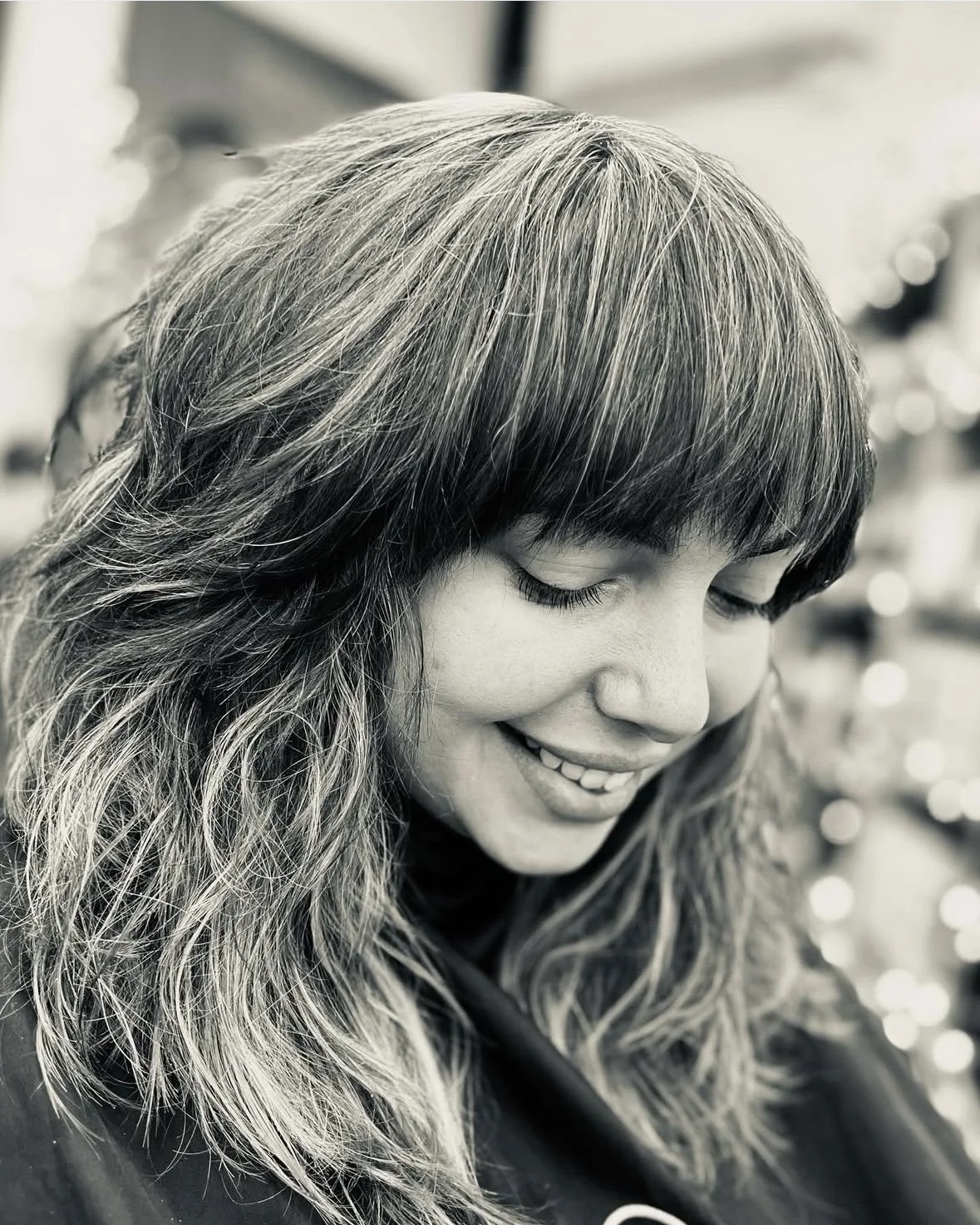 Razor cut, heavy fringe, 70's style, shag cut, wolf cut, thick hair style.