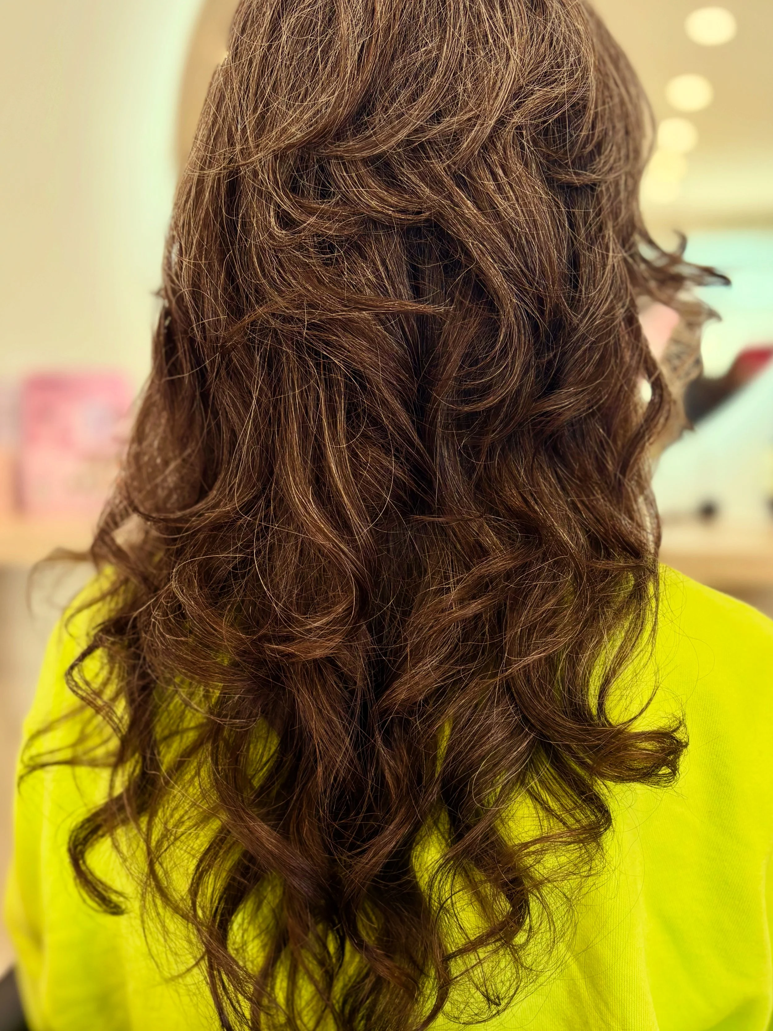 Razor cut, long curly hair with layers