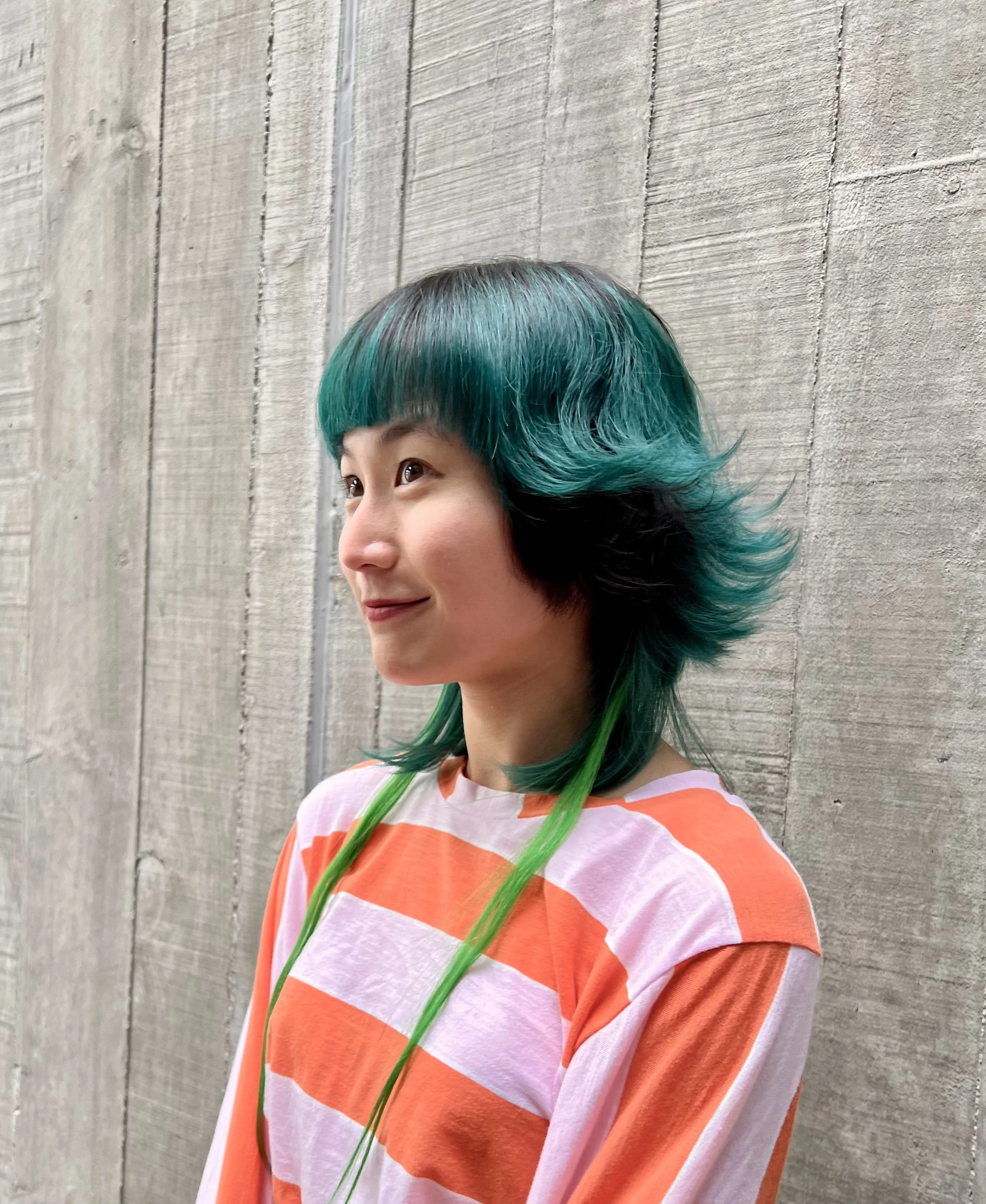 Fun colour and cut, flicked out hair, green hair