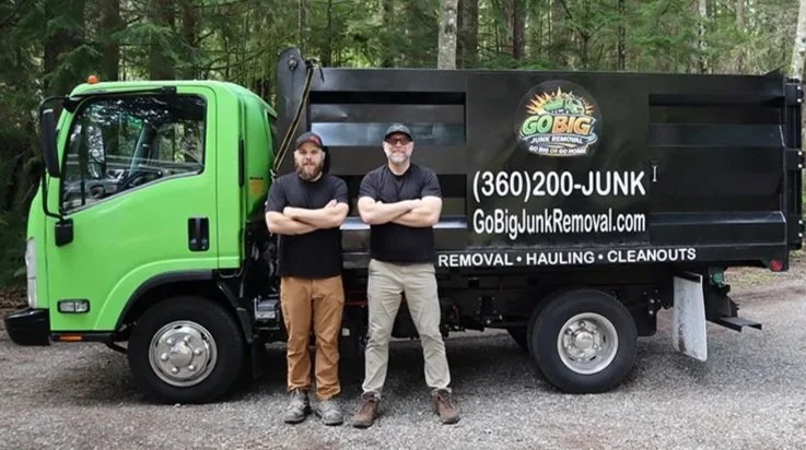 Go Big Junk Removal Truck and Owners