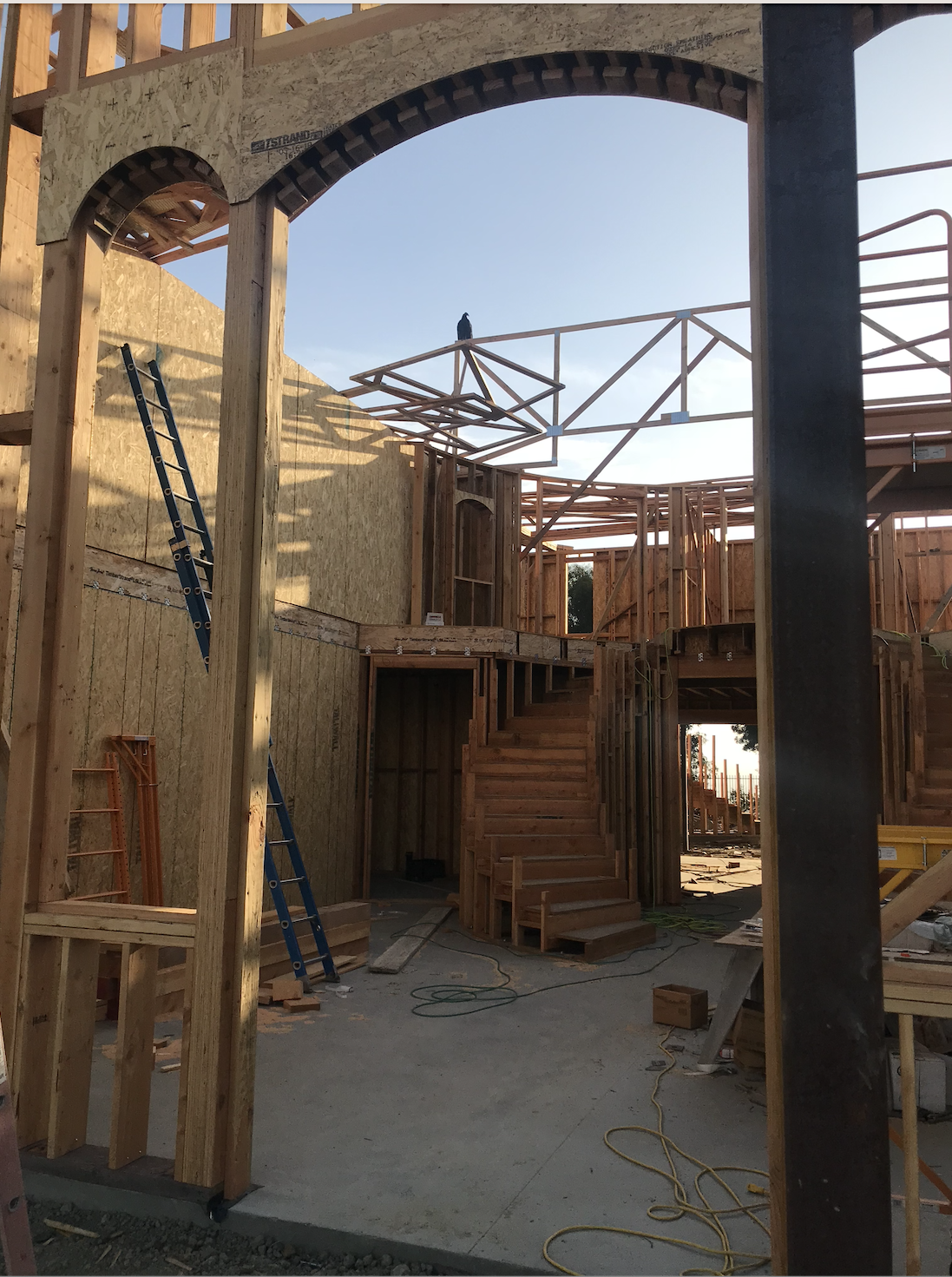 Construction site with wooden framing for the home's grand entrance