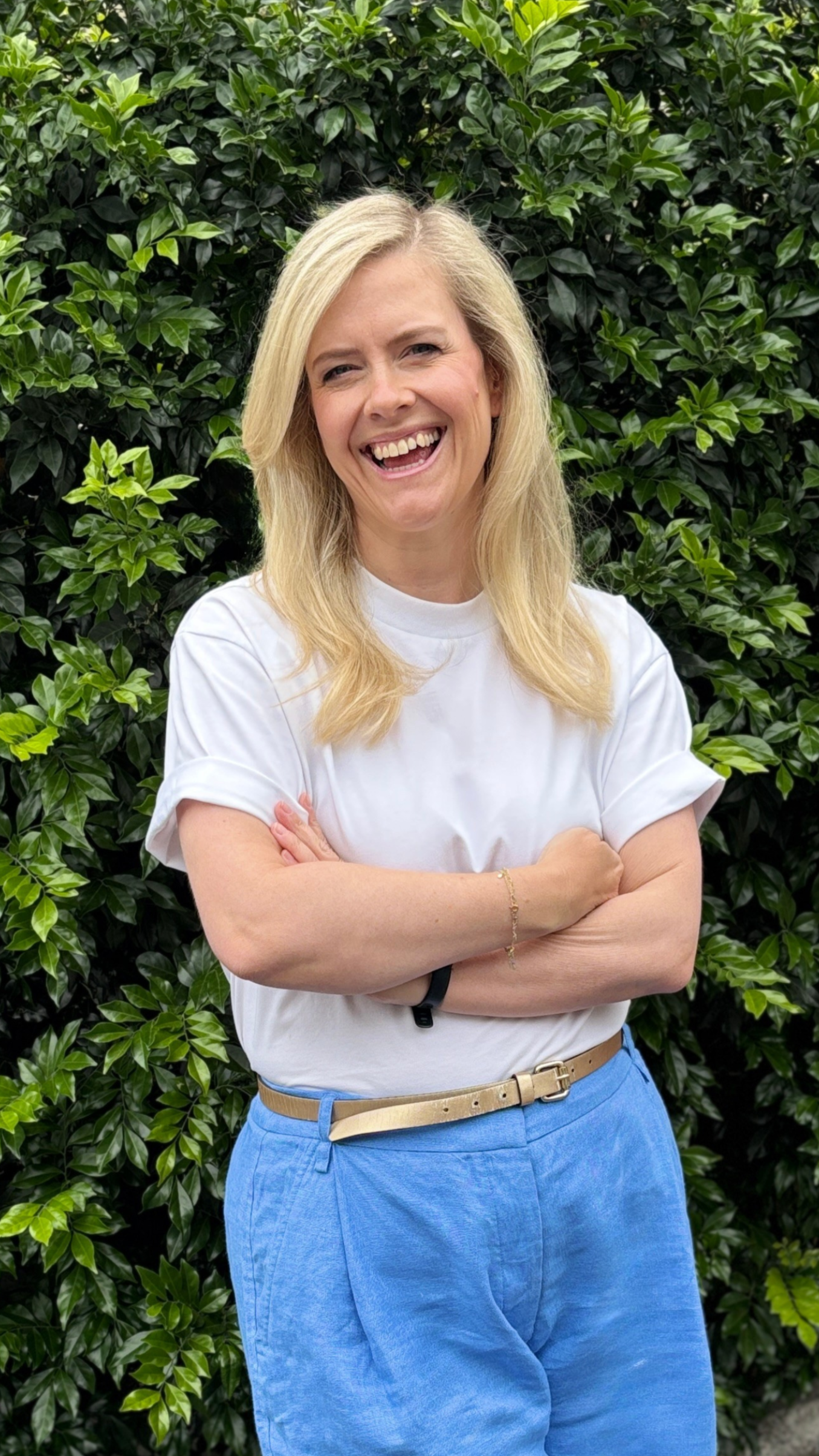 Photo of midlife coach Alice Hamilton smiling and crossing arms