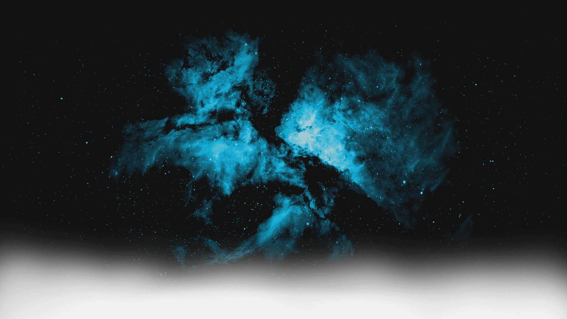 A deep-space image showing a bright, colorful nebula with blue and white hues, surrounded by numerous stars against a dark background.