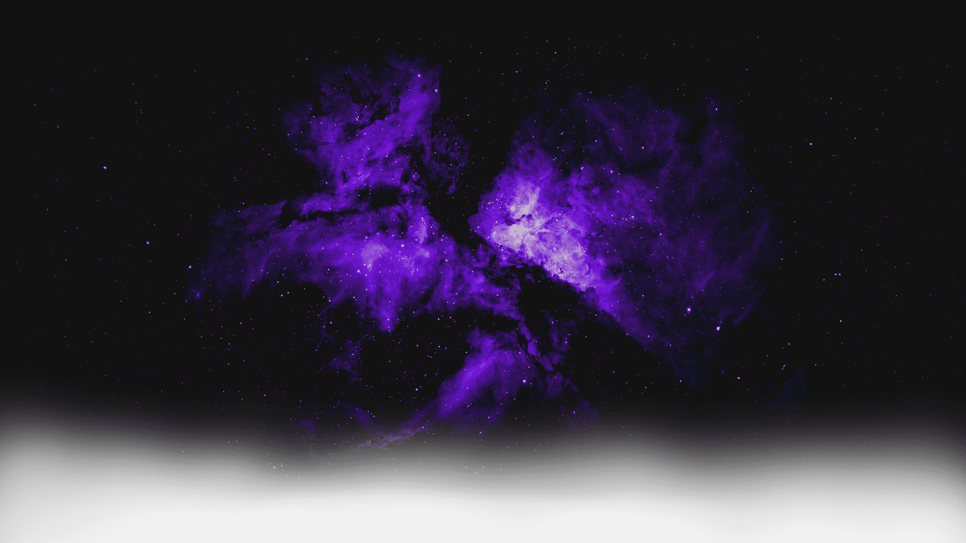 A vibrant purple and black nebula in outer space with numerous stars scattered throughout.