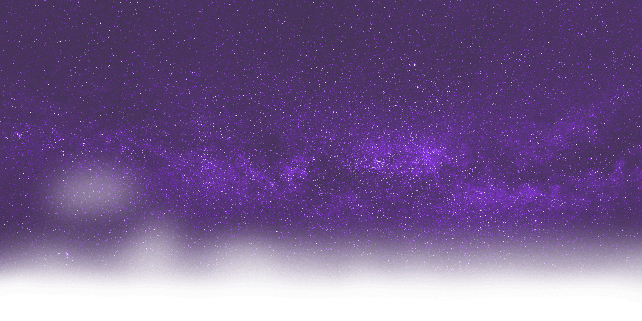 Bright purple night sky filled with countless stars and the Milky Way galaxy visible above a dark horizon.