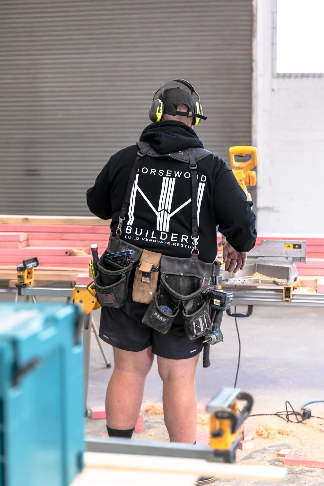Norsewood Builders' owner Nick Picton, cutting timber onsite at a commercial project job site