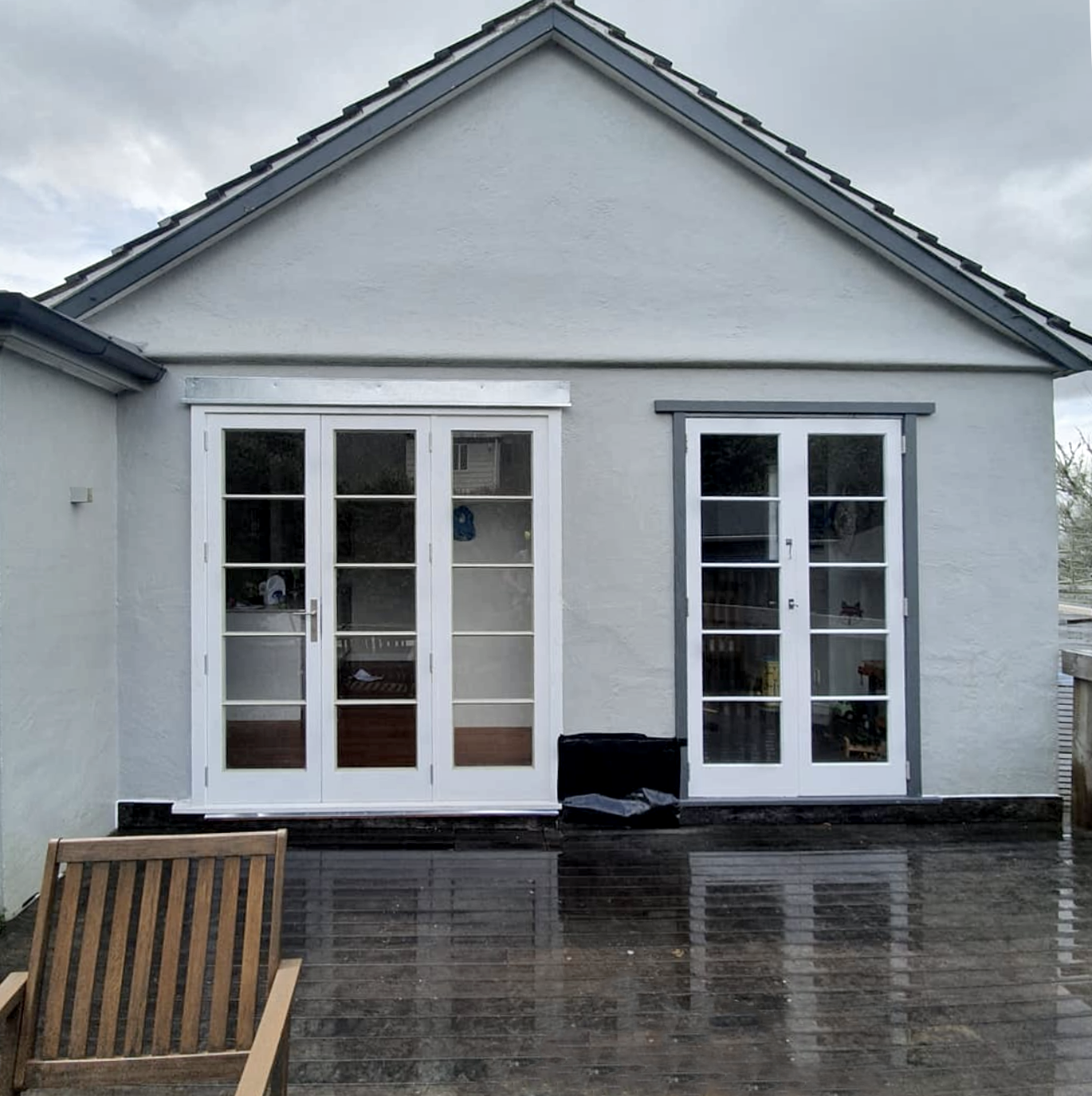 Residential exterior window transformed into door by Norsewood Builders