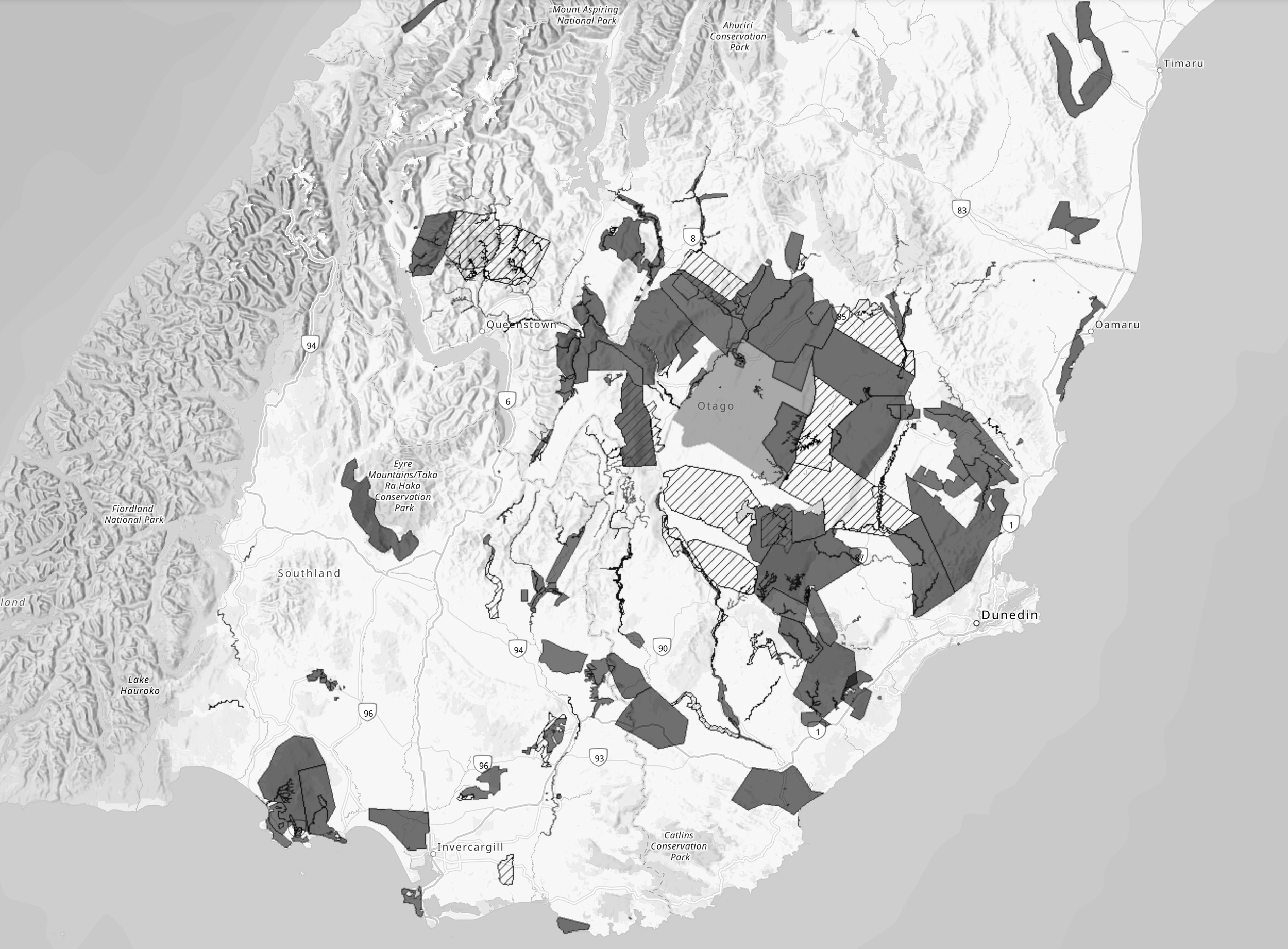 A grayscale map of New Zealand showing various regions marked with different shading patterns.